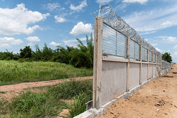 Stone Masonry Perimeter Wall & Heavy Duty Steel Gate Construction